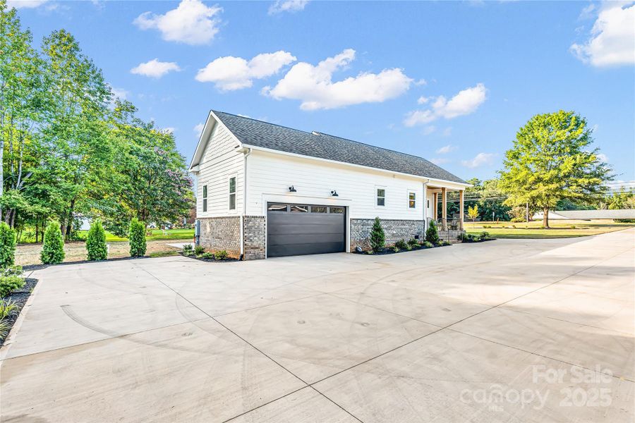 Attached side load 2 car garage on main home