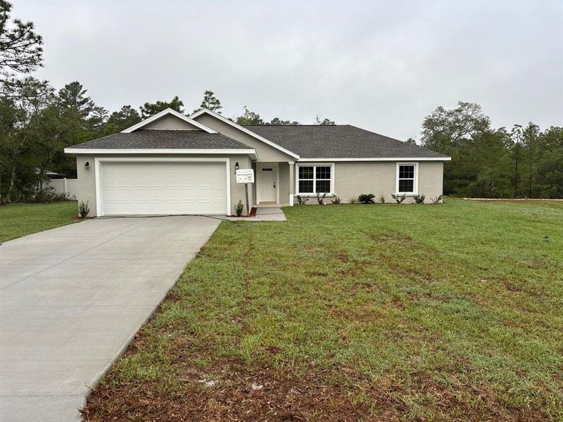 Front exterior of a new home in , Dunnellon, FL, highlighting curb appeal (Image 1). Front exterior of a new home in , Dunnellon, FL, highlighting curb appeal (Image 1).