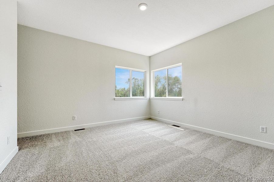 9 ft ceilings on the upper level. Primary bedroom glows with natural light.