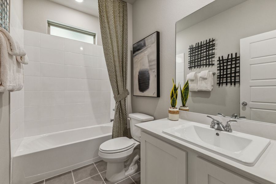 Bathroom in the Stanley II home plan by Trophy Signature Homes – REPRESENTATIVE PHOTO