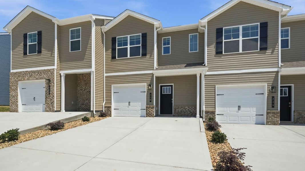 Front exterior of a new home in Cherokee Crossing, Kodak, TN, highlighting curb appeal (Image 1). Front exterior of a new home in Cherokee Crossing, Kodak, TN, highlighting curb appeal (Image 1).