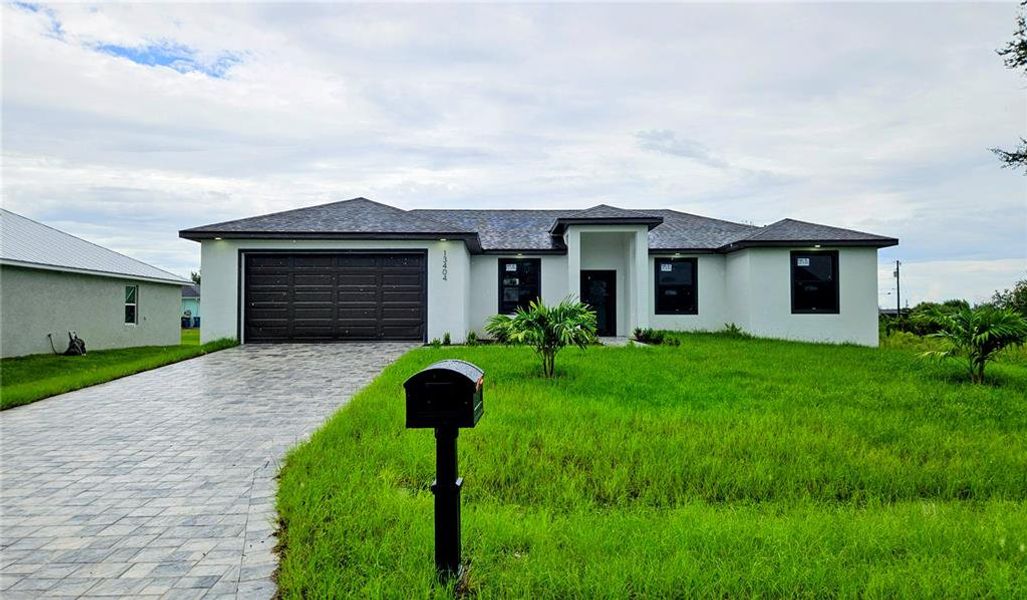 Front exterior of a new home in , Port Charlotte, FL, highlighting curb appeal (Image 26).