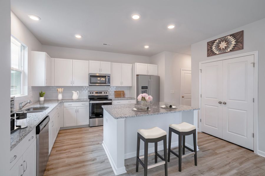 Representative furnished interior of a home built from the Winslow by McKee Homes in Bedford, Raeford (Image 2).