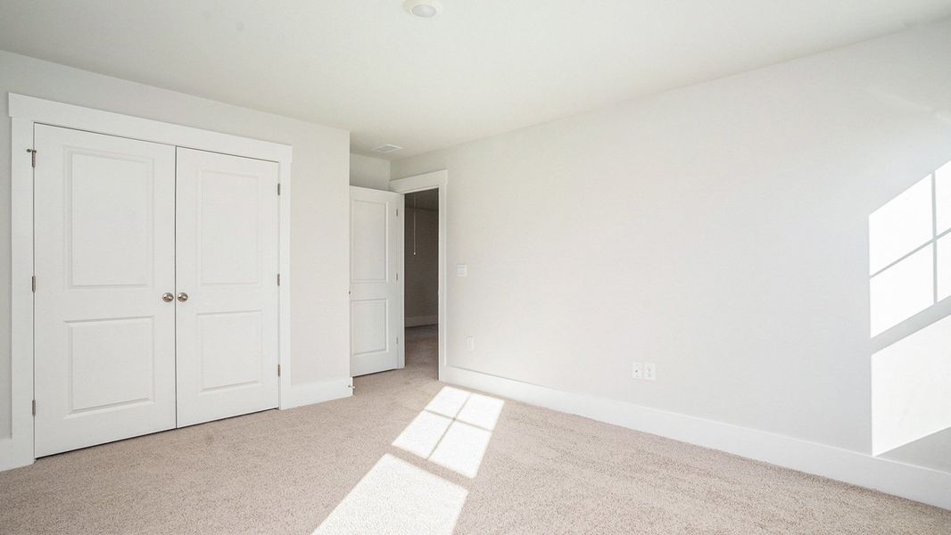 Spacious, unfurnished interior of a new home in Coastal Farms, Conway (Image 24).