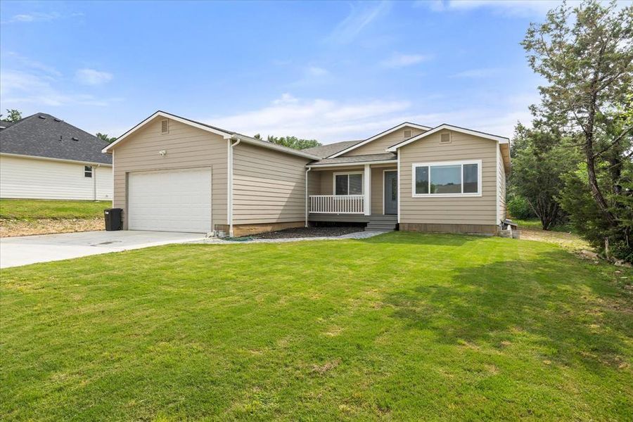 Front exterior of a new home in , Granbury, TX, highlighting curb appeal (Image 24).