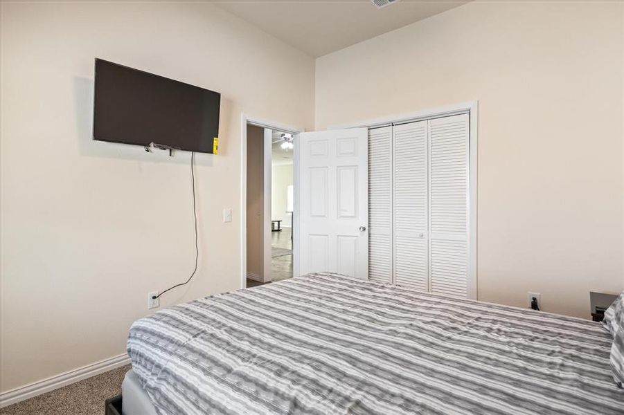 Bedroom with carpet floors and a closet