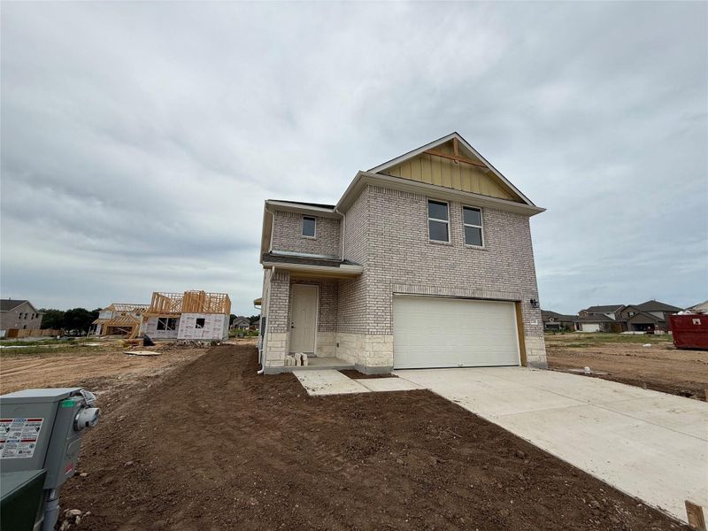 Front exterior of a new home in , San Marcos, TX, highlighting curb appeal (Image 17). Front exterior of a new home in , San Marcos, TX, highlighting curb appeal (Image 17).