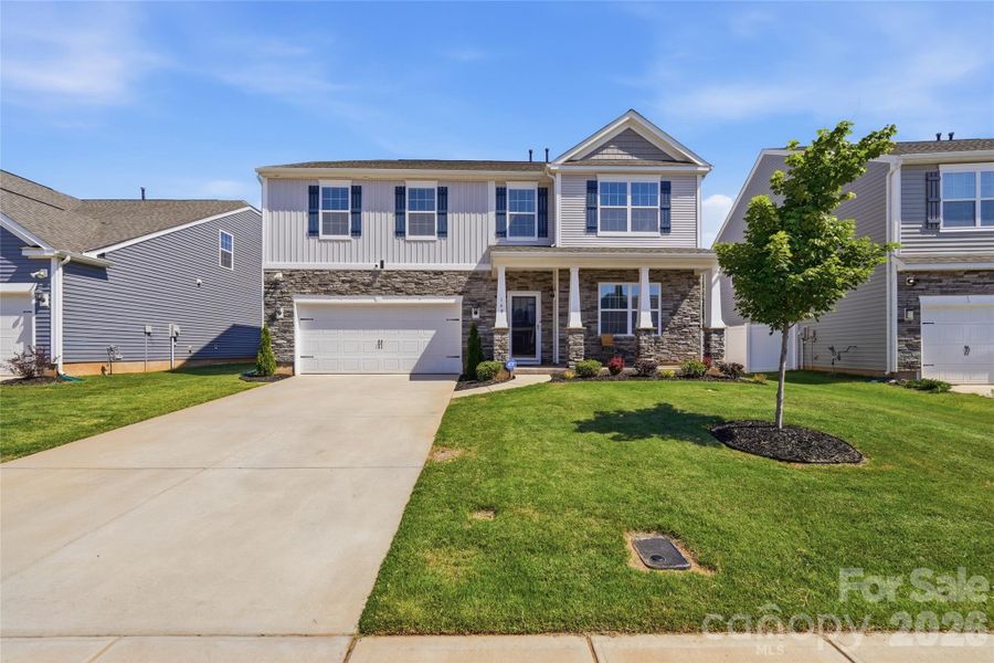Front exterior of a new home in Wallace Springs, Statesville, NC, highlighting curb appeal (Image 2). Front exterior of a new home in Wallace Springs, Statesville, NC, highlighting curb appeal (Image 2).
