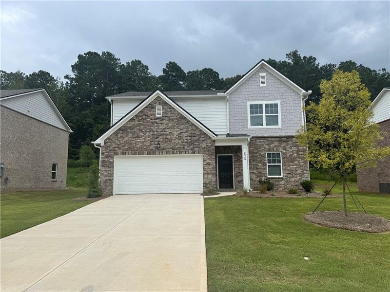 Front exterior of a new home in Silverton, Dacula, GA, highlighting curb appeal (Image 16). Front exterior of a new home in Silverton, Dacula, GA, highlighting curb appeal (Image 16).