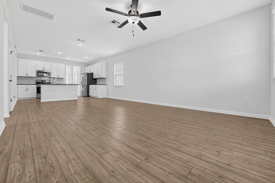 Representative unfurnished interior of a home built from the Pheasant by Taylor Morrison in Emory Crossing, Hutto (Image 8).