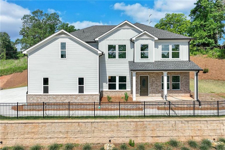 Front exterior of a new home in , Gainesville, GA, highlighting curb appeal (Image 1).