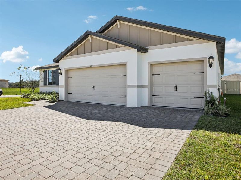 Front exterior of a new home in Two Rivers - Signature Series, Zephyrhills, FL, highlighting curb appeal (Image 2). Front exterior of a new home in Two Rivers - Signature Series, Zephyrhills, FL, highlighting curb appeal (Image 2).