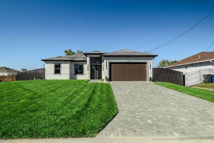 Front exterior of a new home in , Lehigh Acres, FL, highlighting curb appeal (Image 1). Front exterior of a new home in , Lehigh Acres, FL, highlighting curb appeal (Image 1).