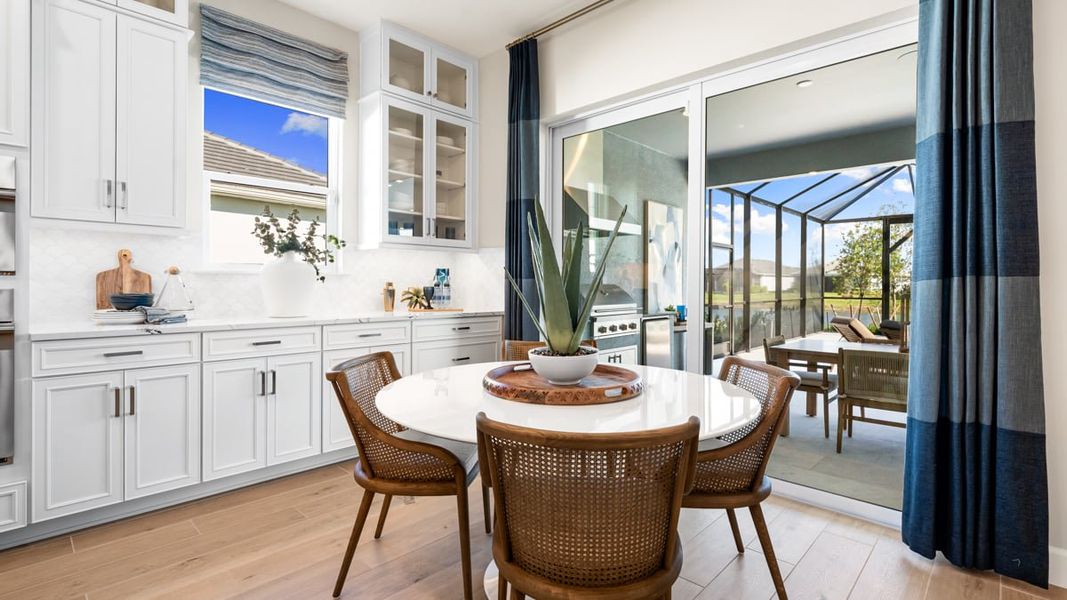 Furnished interior view inside a new home in Esplanade by the Islands, Naples (Image 11).