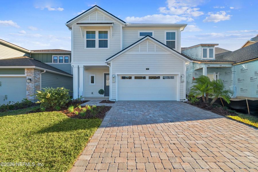 Front exterior of a new home in Crosswinds 40’, Ponte Vedra, FL, highlighting curb appeal (Image 1). Front exterior of a new home in Crosswinds 40’, Ponte Vedra, FL, highlighting curb appeal (Image 1).
