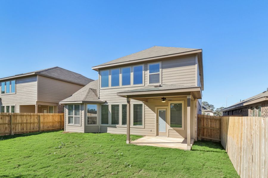 Back exterior of the Cedar floorplan at a Meritage Homes community.