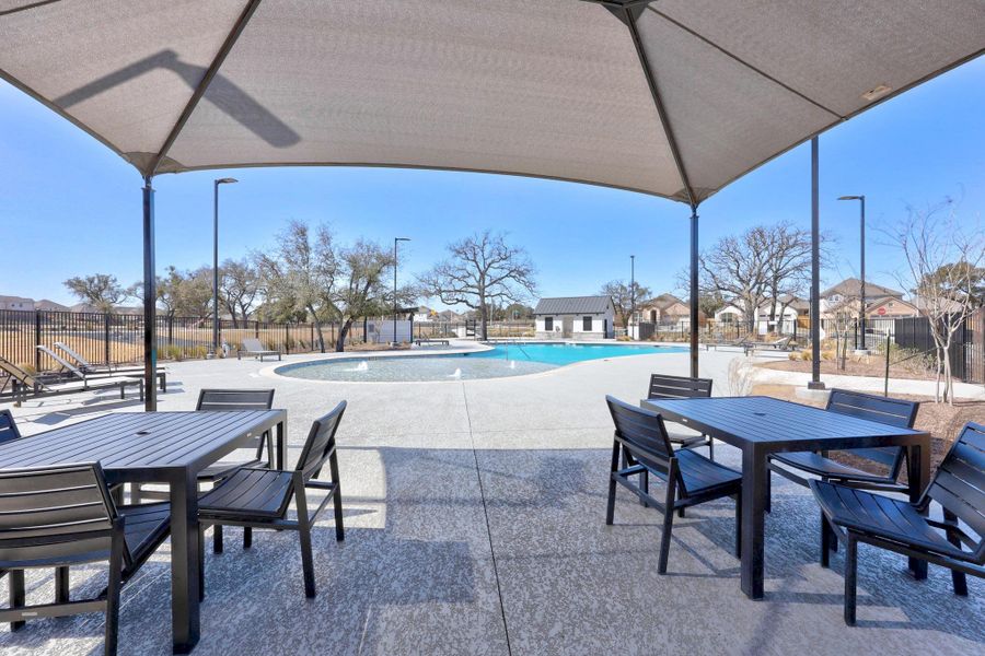 HOA Amenity Center: Pool with outdoor dining space, a patio area, and fence