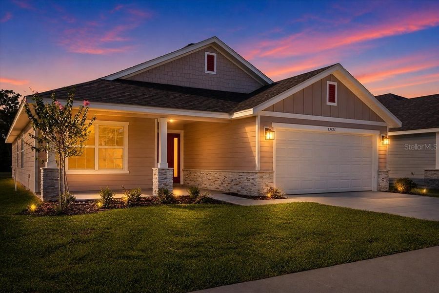 Front exterior of a new home in Kirkland Farms, Alachua, FL, highlighting curb appeal (Image 22).