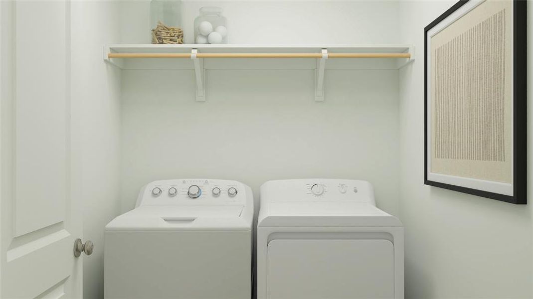 Laundry room with washer and clothes dryer