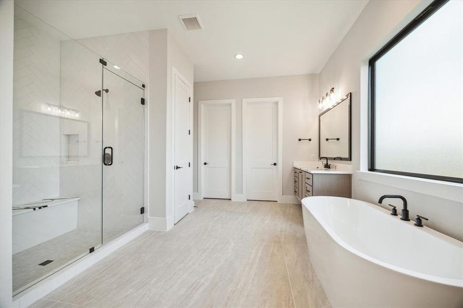 The shower has 2 showerheads plus a seat that runs the length of the space for a clean look.