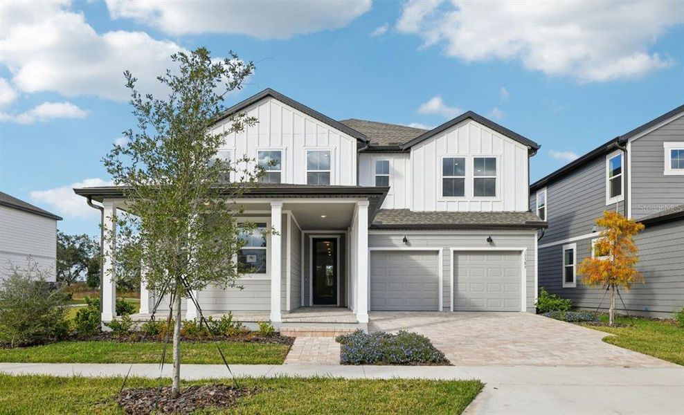 Front exterior of a new home in Northlake Traditional, Winter Garden, FL, highlighting curb appeal (Image 25). Front exterior of a new home in Northlake Traditional, Winter Garden, FL, highlighting curb appeal (Image 25).