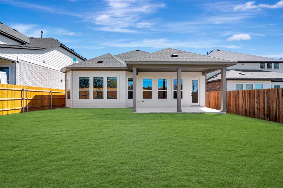 Exterior details and patio area of a home in Heritage, Dripping Springs (Image 3).