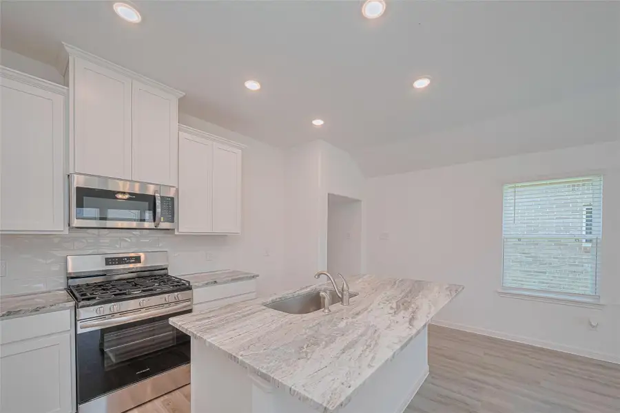 Furnished interior view inside a new home in Sunterra, Katy (Image 9).