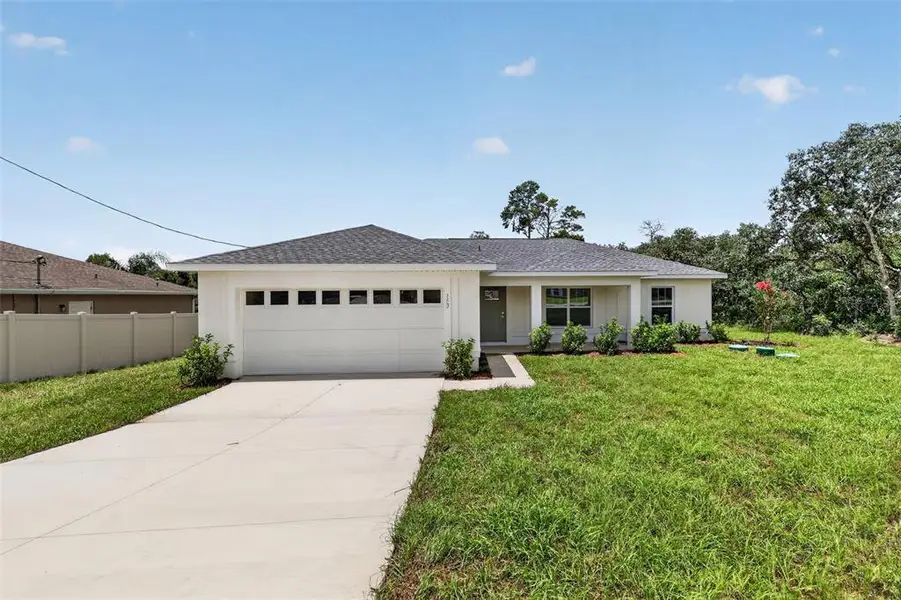 Front exterior of a new home in , Ocala, FL, highlighting curb appeal (Image 2). Front exterior of a new home in , Ocala, FL, highlighting curb appeal (Image 2).