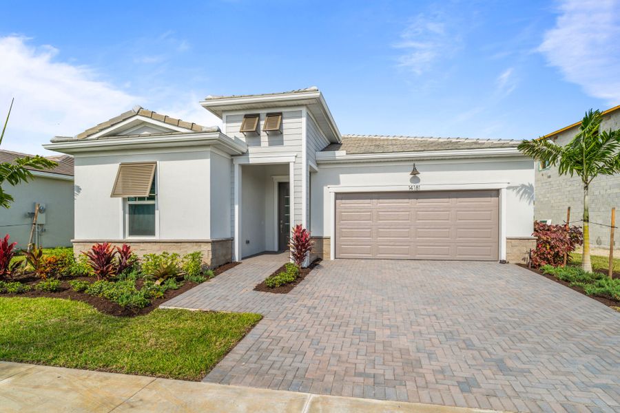 Representative exterior photo of a completed home built from the Rosewood by Mattamy Homes in Tradition, Port St. Lucie, FL (Image 16).