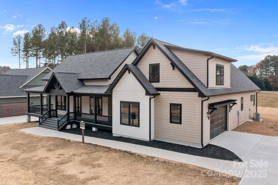 Front exterior of a new home in , Statesville, NC, highlighting curb appeal (Image 2). Front exterior of a new home in , Statesville, NC, highlighting curb appeal (Image 2).