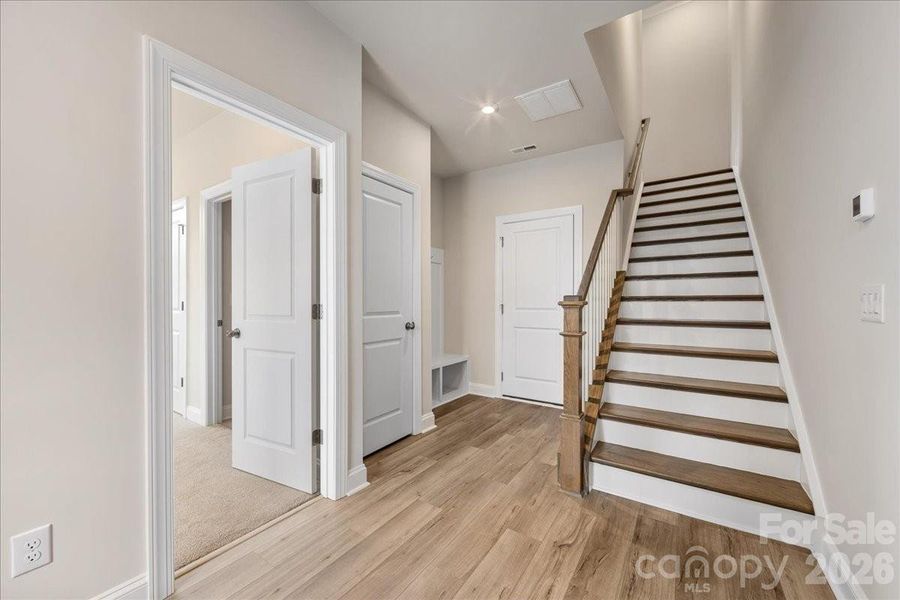 Foyer with Oak Box Stairs and Drop Zone