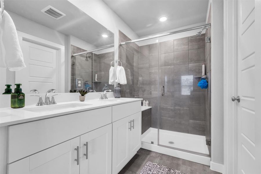 You will love the oversized walk in shower and the double sinks on the vanity.  Huge walk-in closet on the right.