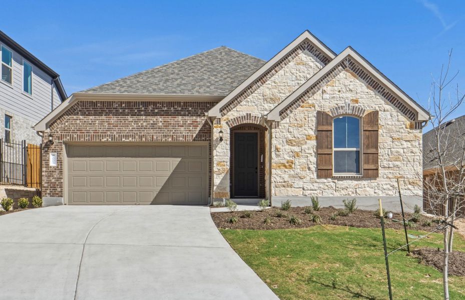 Front exterior of a new home in West Cypress Hills, Spicewood, TX, highlighting curb appeal (Image 22). Front exterior of a new home in West Cypress Hills, Spicewood, TX, highlighting curb appeal (Image 22).