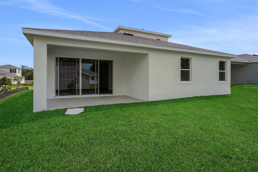 Exterior details and patio area of a home in Tuscan Hills, Dade City (Image 23).