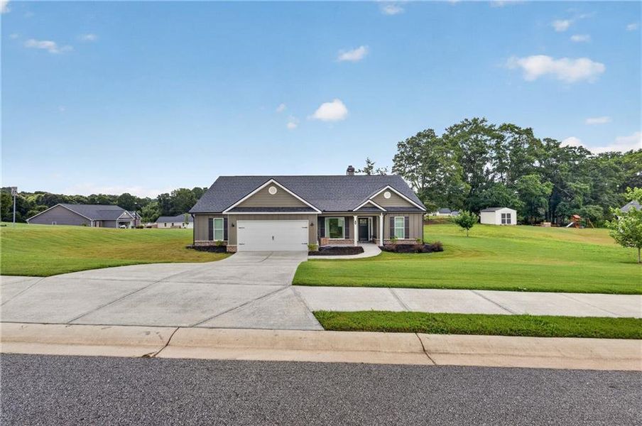 Front exterior of a new home in , Winder, GA, highlighting curb appeal (Image 26).