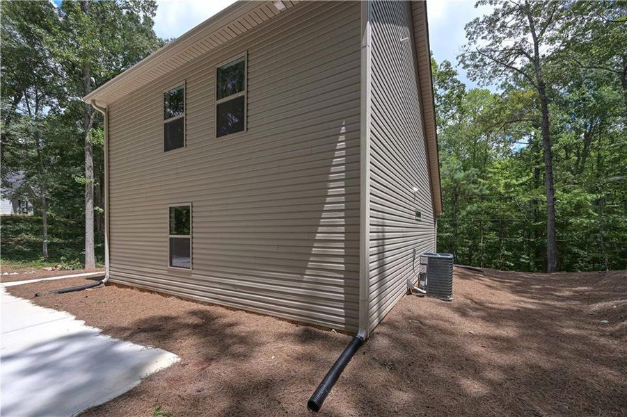 Front exterior of a new home in , Buchanan, GA, highlighting curb appeal (Image 2).