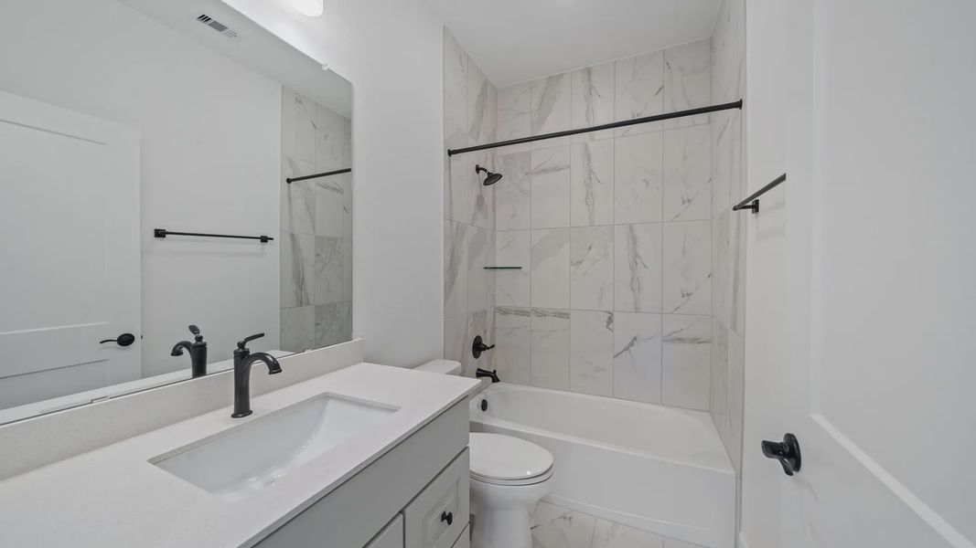 Representative furnished interior of a home built from the Waterloo by Chesmar Homes in Attwater 65's, Waller (Image 13).
