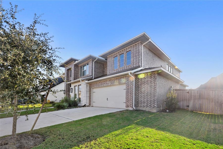 Front exterior of a new home in Fulbrook On Fulshear Creek 60', Fulshear, TX, highlighting curb appeal (Image 2). Front exterior of a new home in Fulbrook On Fulshear Creek 60', Fulshear, TX, highlighting curb appeal (Image 2).