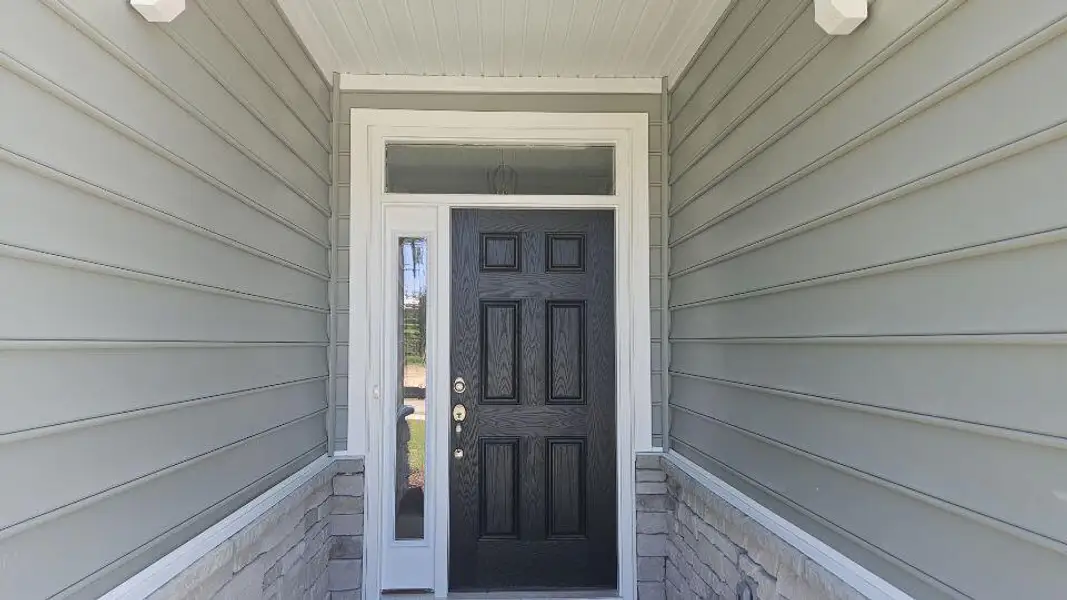 Exterior details and patio area of a home in The Enclave at French Quarter Creek, Huger (Image 2).