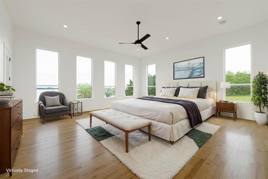 Bedroom with light wood-style flooring, a ceiling fan, and recessed lighting
