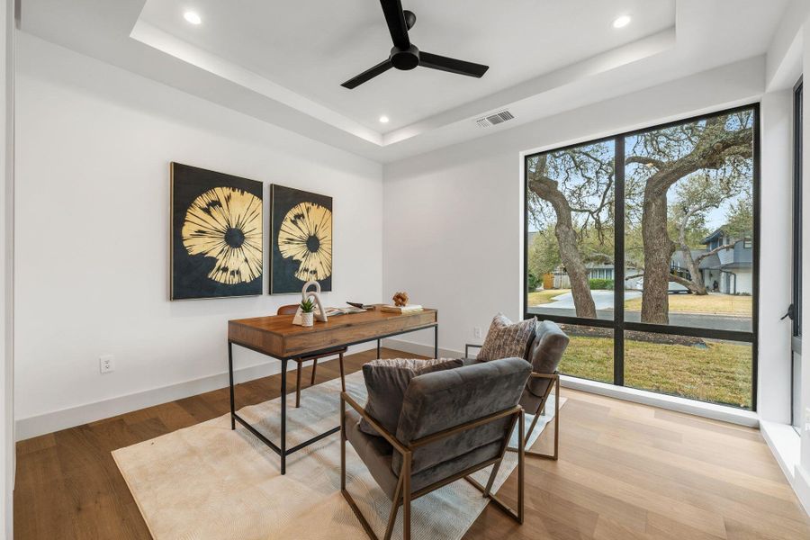 Office space with recessed lighting, wood finished floors, a ceiling fan