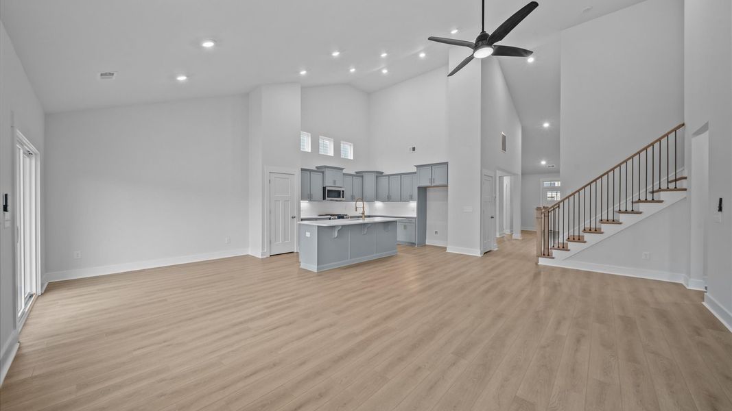 Elegant family room with soaring two-story ceilings and abundant natural light in this first-class DRB Homes design Elegant family room with soaring two-story ceilings and abundant natural light in this first-class DRB Homes design