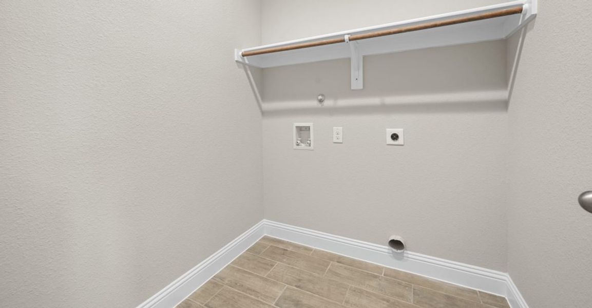 Representative exterior photo of a completed home built from the Donnington by Impression Homes in Still Water Lake, Godley, TX (Image 24).