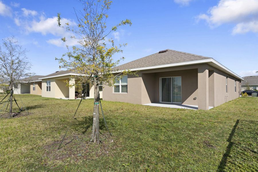 Exterior details and patio area of a home in Central Park 40s, Port St. Lucie (Image 4).