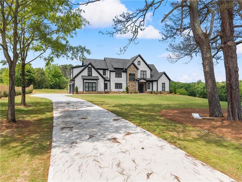 Front exterior of a new home in , Cumming, GA, highlighting curb appeal (Image 26). Front exterior of a new home in , Cumming, GA, highlighting curb appeal (Image 26).