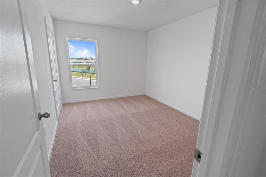 Spacious, unfurnished interior of a new home in Peach Crossings, Winter Haven (Image 22).