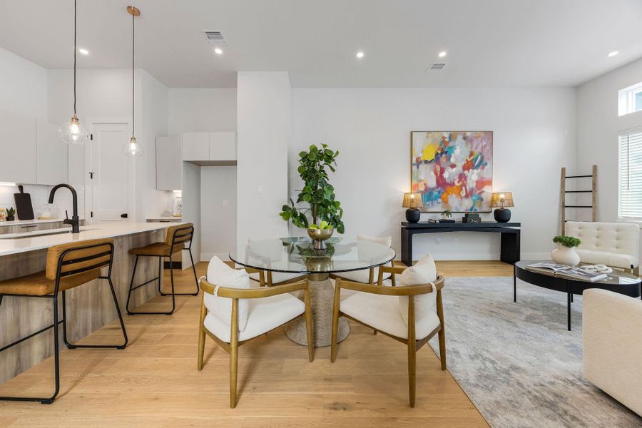 Modern open-concept living in the heart of Independence Heights featuring expansive living and dining spaces, oversized windows, designer lighting, and seamless flow ideal for entertaining and everyday comfort.