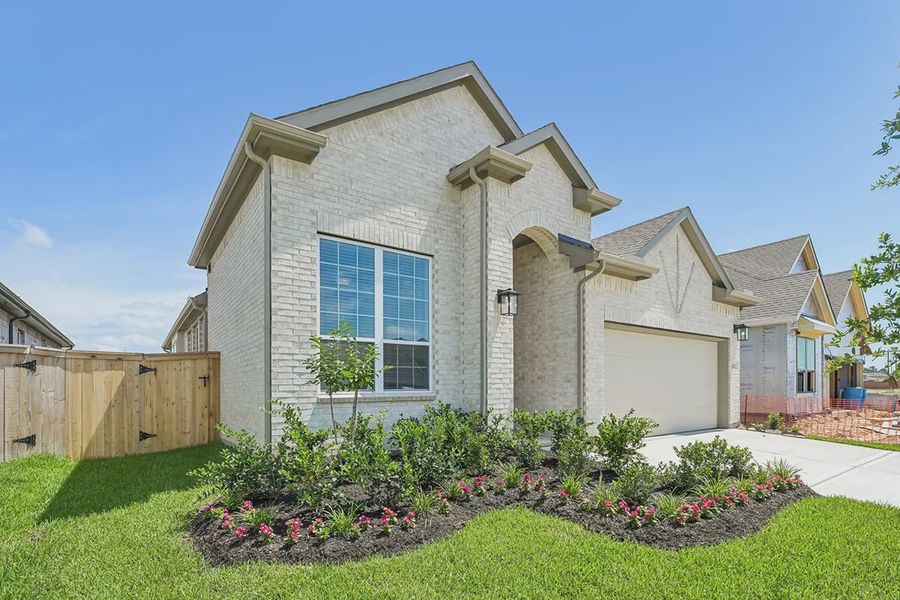 Front exterior of a new home in Wood Leaf Reserve, Tomball, TX, highlighting curb appeal (Image 2). Front exterior of a new home in Wood Leaf Reserve, Tomball, TX, highlighting curb appeal (Image 2).