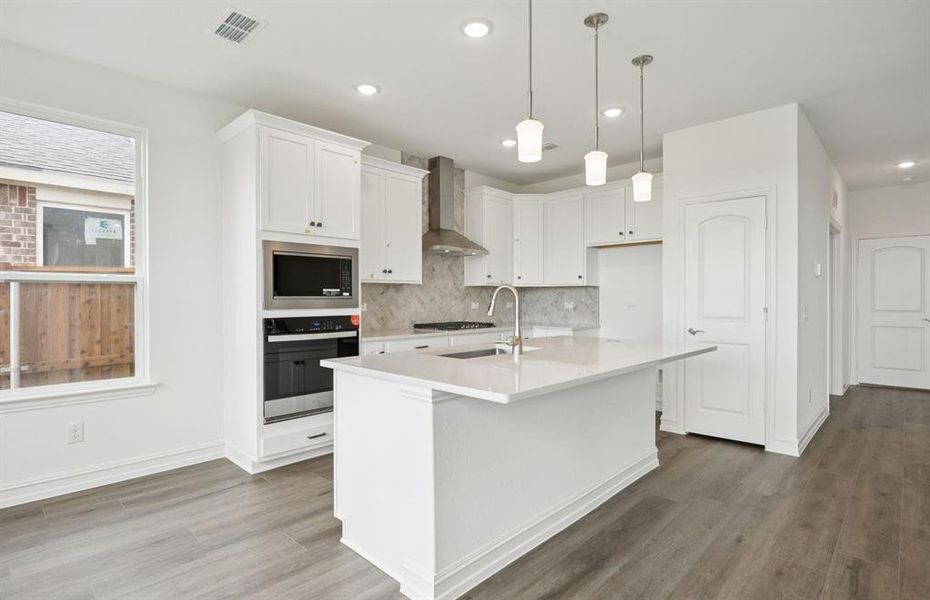 Kitchen featuring a large island ideal for informal dining and gatherings *Real home pictured Kitchen featuring a large island ideal for informal dining and gatherings *Real home pictured