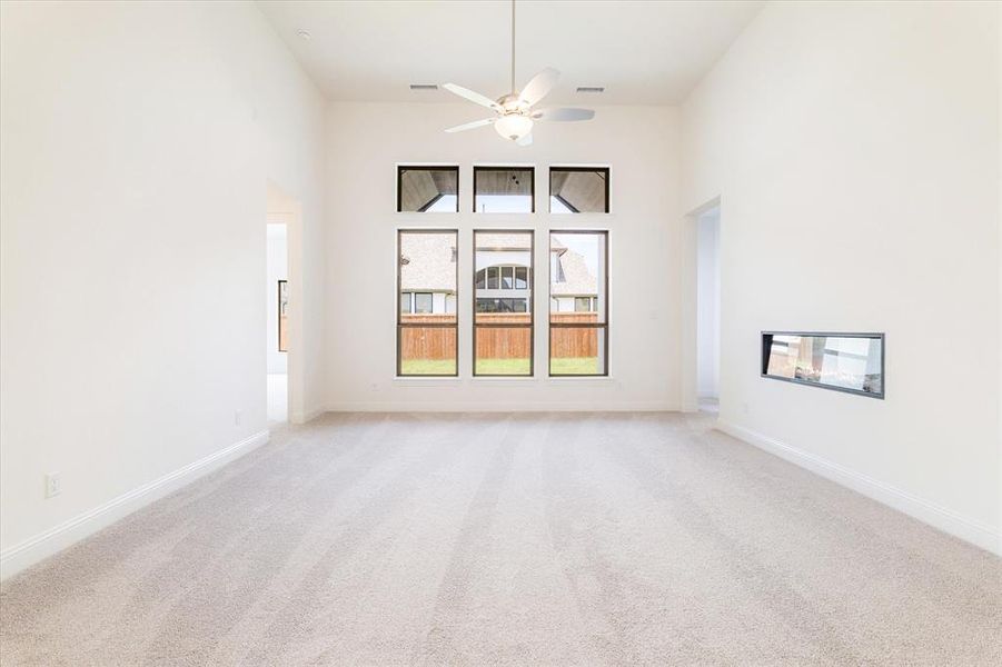 Open living area with electric fireplace